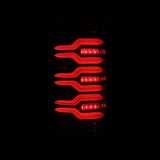 AlphaRex 14-18 GMC Sierra 1500/2500HD/3500HD LUXX-Series LED Tail Lights Alpha-Blk Actv Lgt Seq. Sig